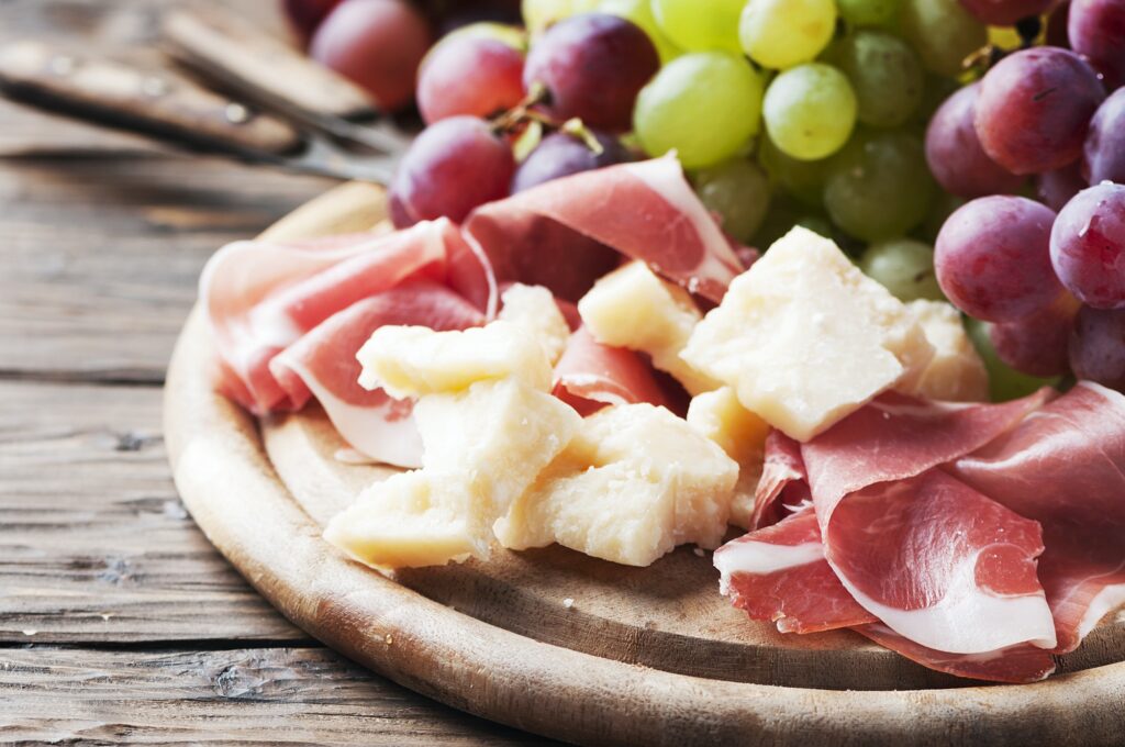 Antipasto with grape, cheese and ham