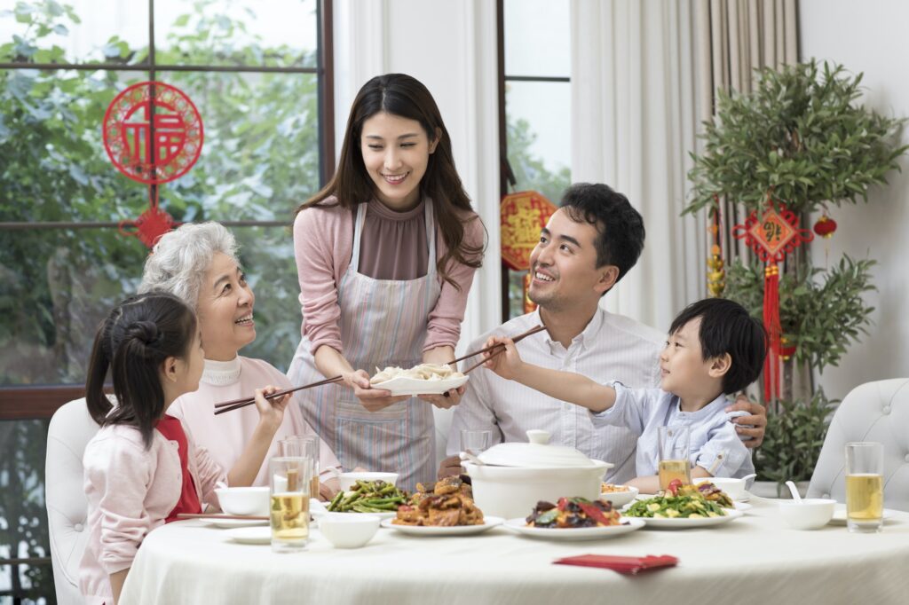 Happy family having Chinese New Year dinner